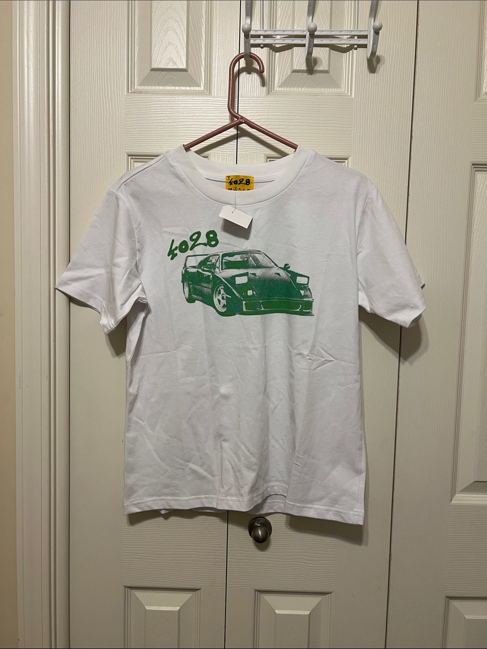 4028 White Graphic Tee. Orig tag missing. Brand new 
100% cotton